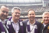 Tasmanian Senator David Bushby, Finance Minister Mathias Cormann and Trade Minister Steve Ciobo at an AFL Grand Final match.
