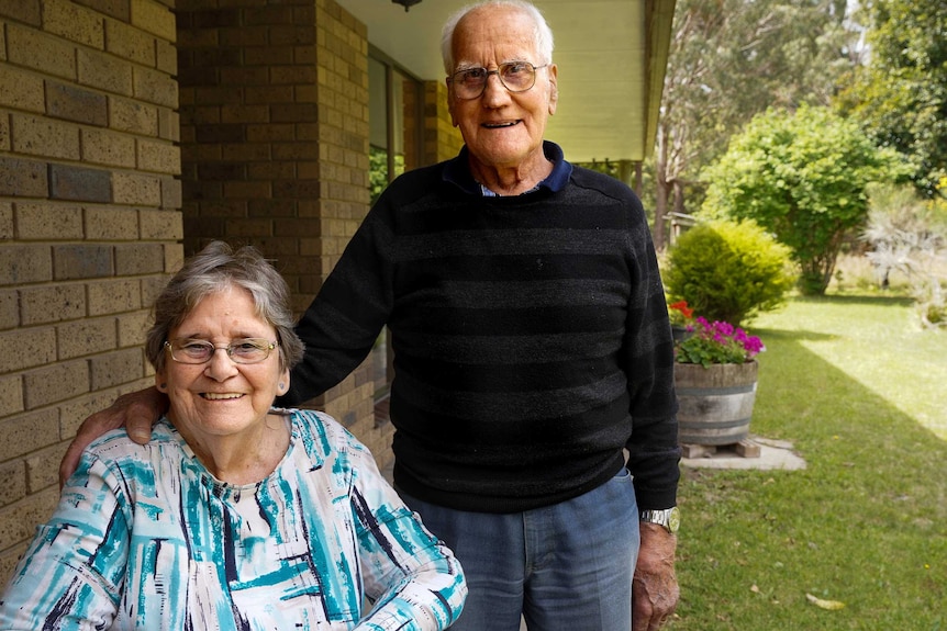 Florence and Bob Thomson in the yard of their home