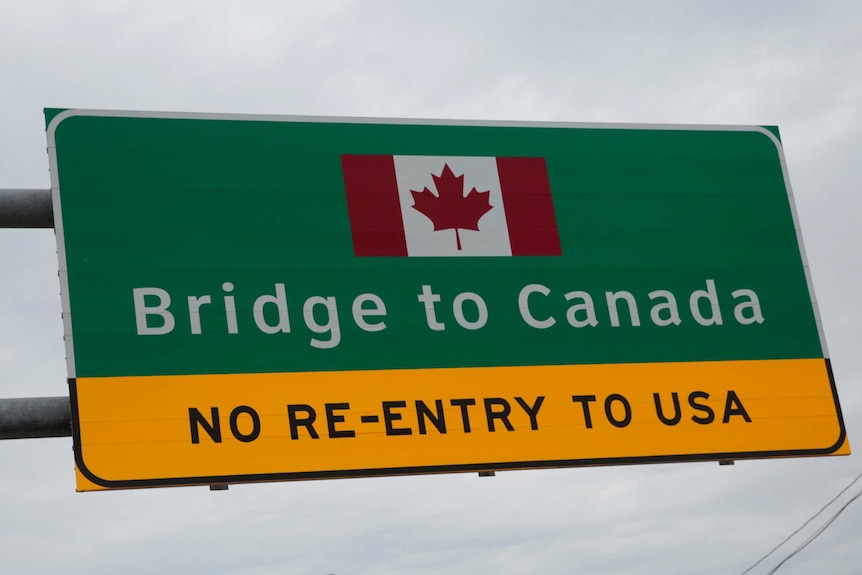 A "Bridge to Canada" sign is seen directing traffic to the Ambassador Bridge.