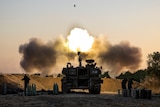 An Israeli artillery unit fires shells towards targets in Gaza Strip, at the Israeli Gaza border.