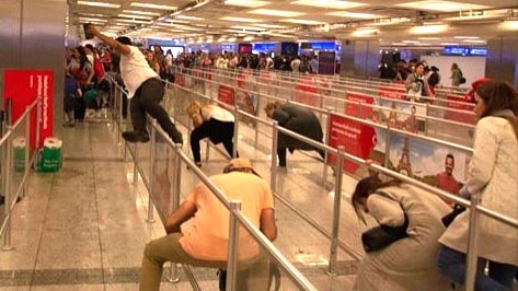 Passengers take cover during Ataturk Airport attack