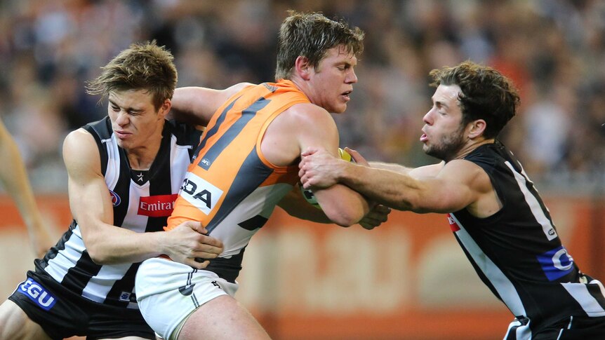 GWS' Taylor Adams gets caught with the ball against Collingwood at the MCG.