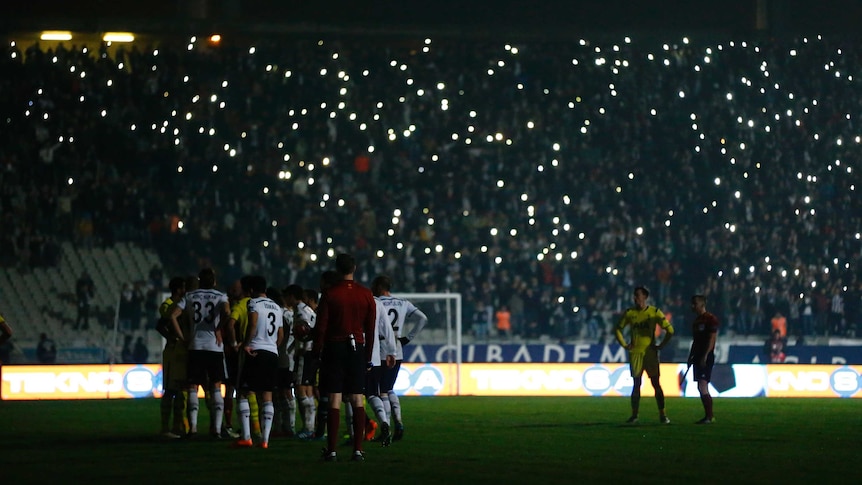 Fans try to light up the Europa League clash between Besiktas and Tottenham Hotspur