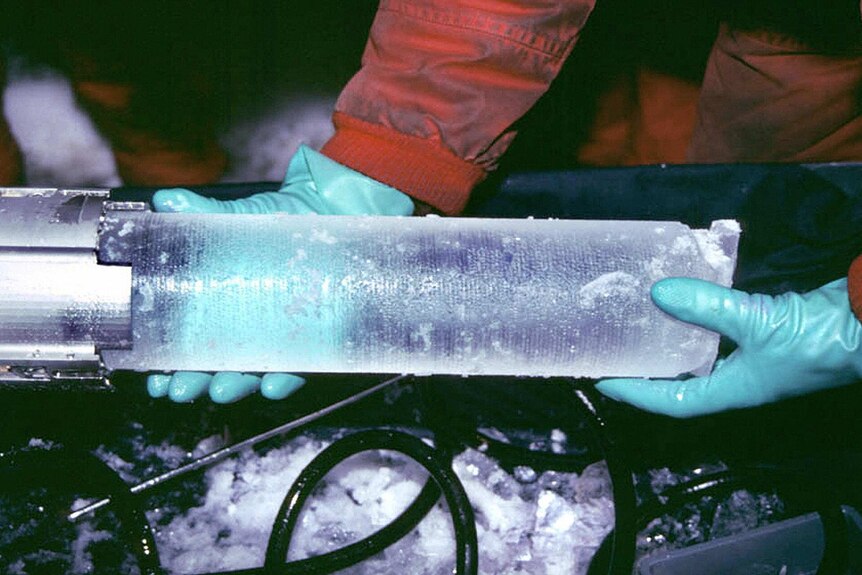 Scientists with ice core