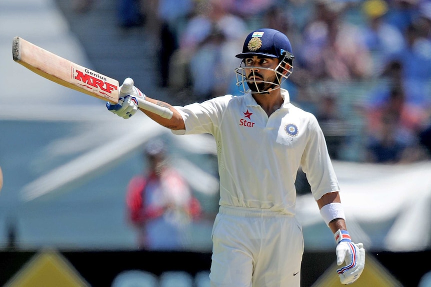 India's Virat Kohli celebrates his 50 against Australia at the MCG
