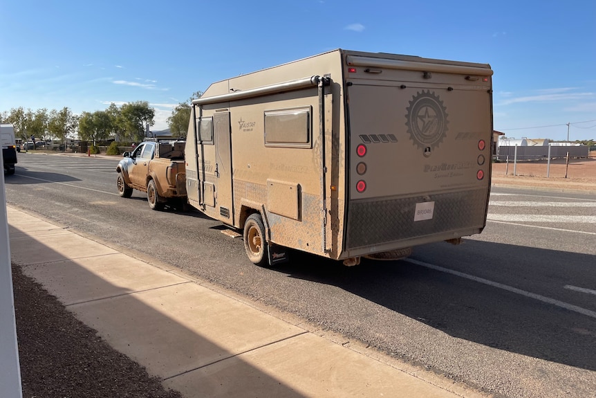 Darren Goodman's caravan covered in dirt after driving the Birdsville Track