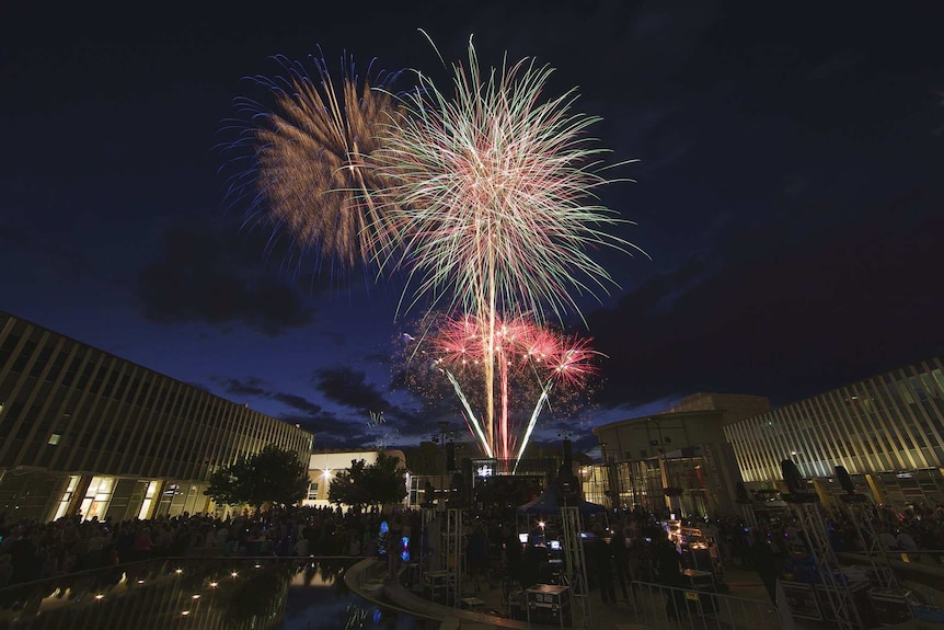Fireworks fill the sky above the Canberra Theatre in Civic Square