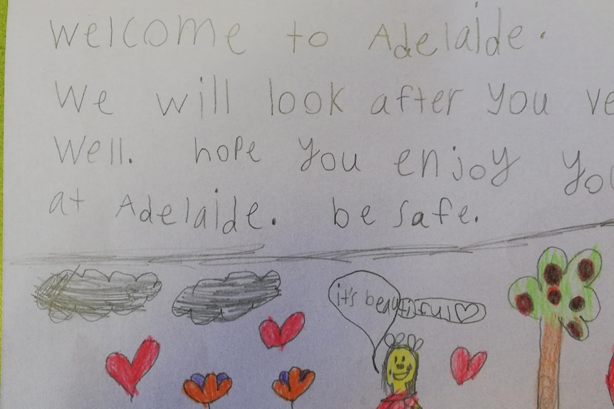 A hand written note that says welcome to Adelaide, we will look after you very well.