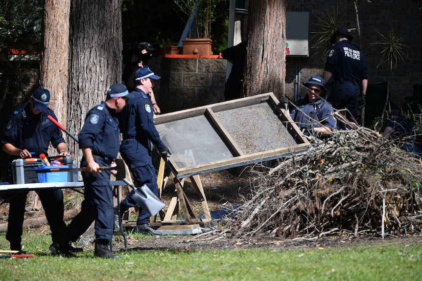 Police clear debris at Tyrrell house