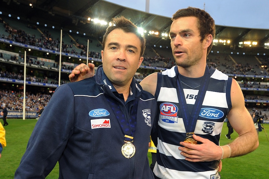 Chris Scott and Matthew Scarlett after AFL grand final win