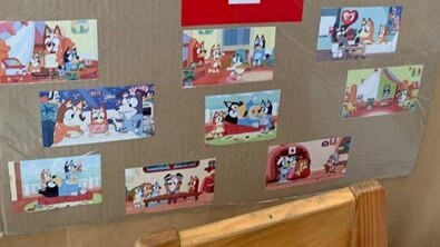 Images from episodes of bluey pasted on a board