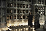 A still from HBO's Game of Thrones showing the Hall of Faces
