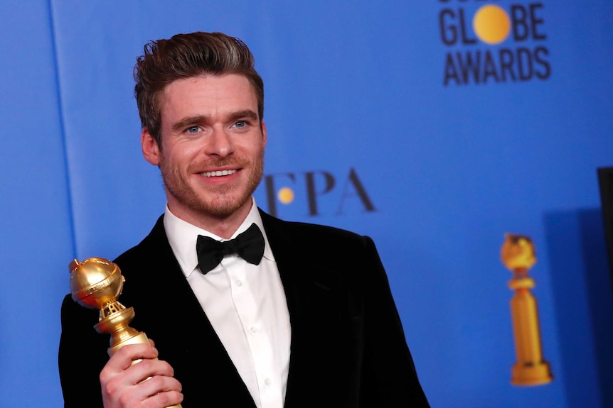 Richard Madden poses backstage with his Golden Globe award