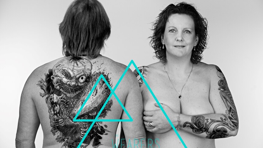 A husband and wife pose together to display their tattoos for The Wearers, Tasmania project.
