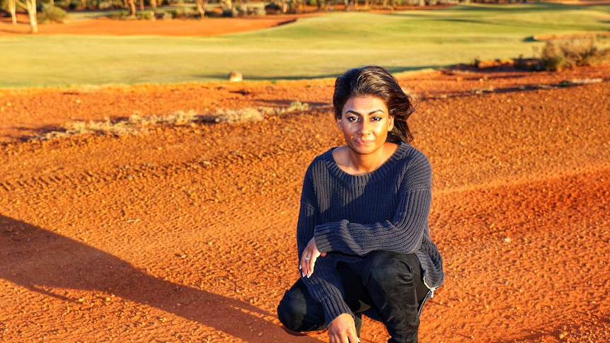 Dinushi Dias on a red dirt road.