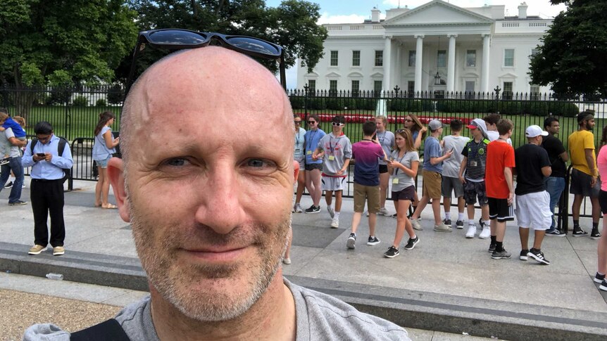 ABC journalist Rafael Epstein takes a selfie in front of the White House in Washington DC.