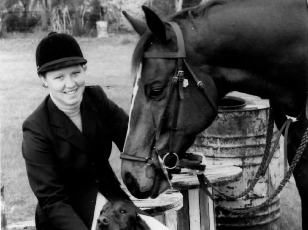 A photo of Merryn Bojcun with her horse and dog