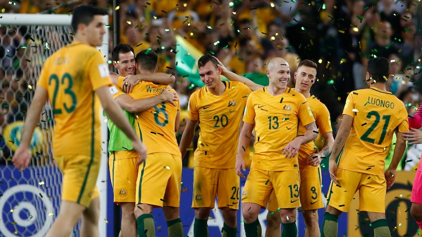 Socceroos celebrate qualifying for 2018 World Cup after eliminating Honduras.