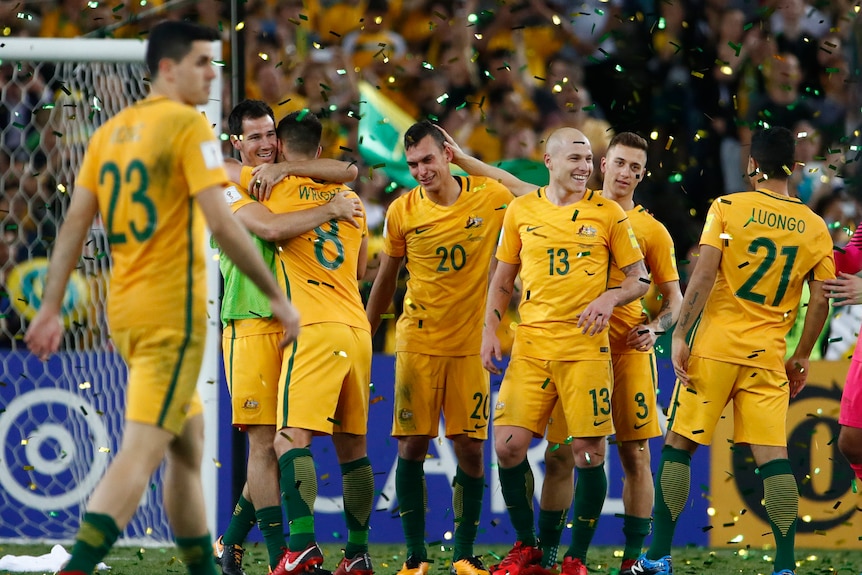 Socceroos celebrate qualifying for 2018 World Cup after eliminating Honduras.