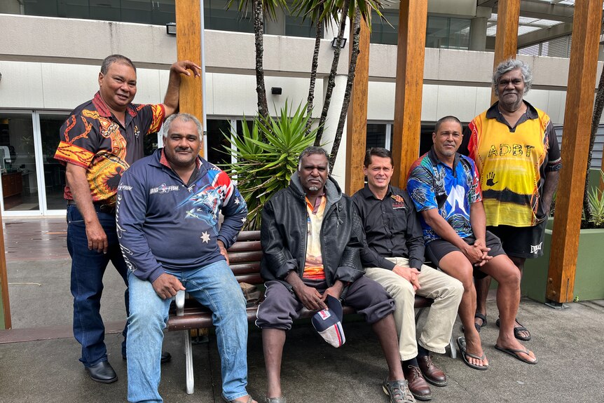 A smiling group of Indigenous men.