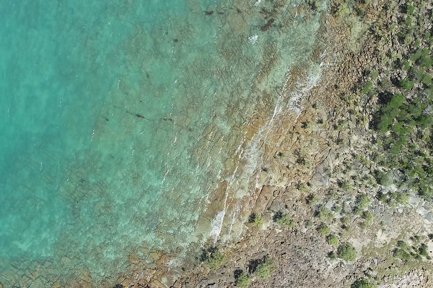 Drone picture rocks and blue water