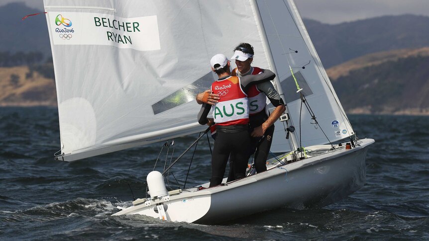 Matthew Belcher and Will Ryan embrace after winning sailing silver