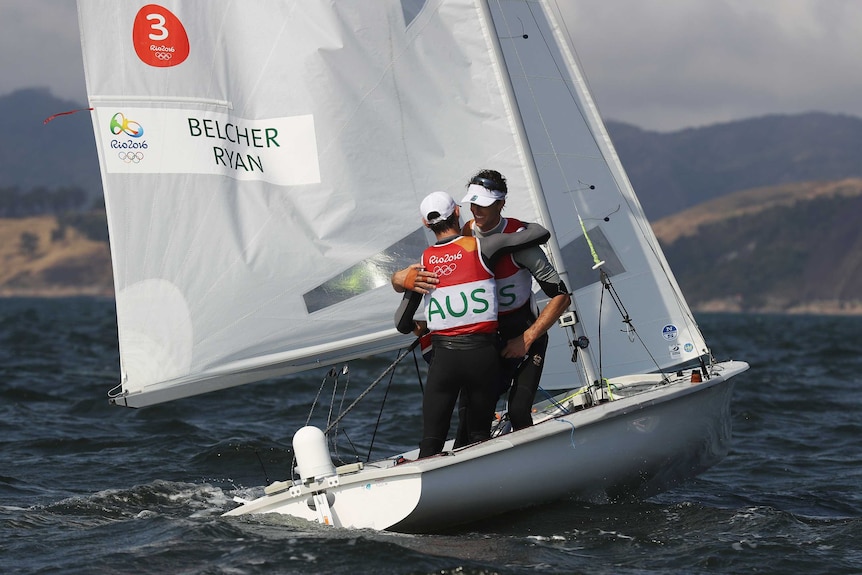 Matthew Belcher and Will Ryan embrace after winning sailing silver