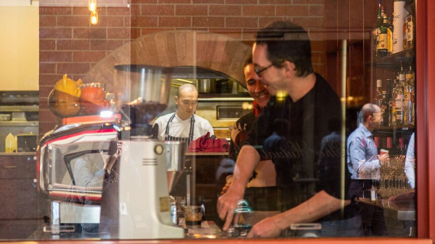 Baristas at work in a Melbourne cafe