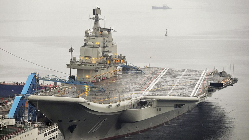 China's first aircraft carrier, Liaoning, docked at Dalian Port