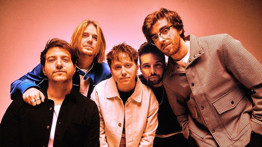 Nothing But Thieves in front of a pink background