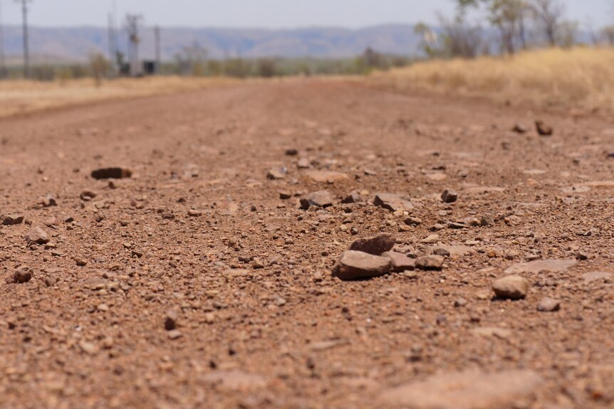 focus on rocks on a dirt road 