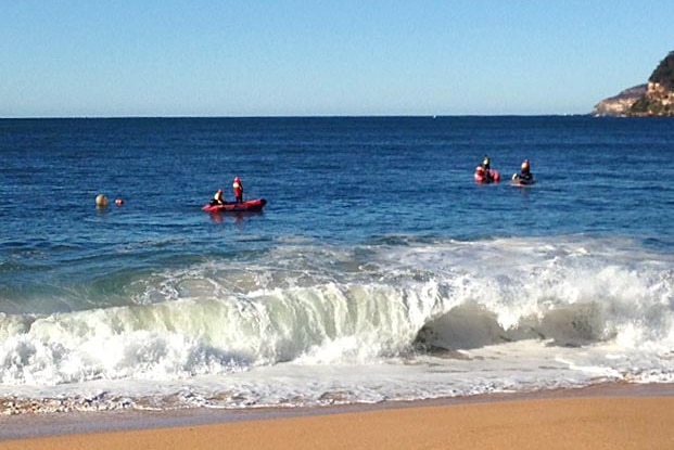Rescuers on jet skis at Pearl Beach