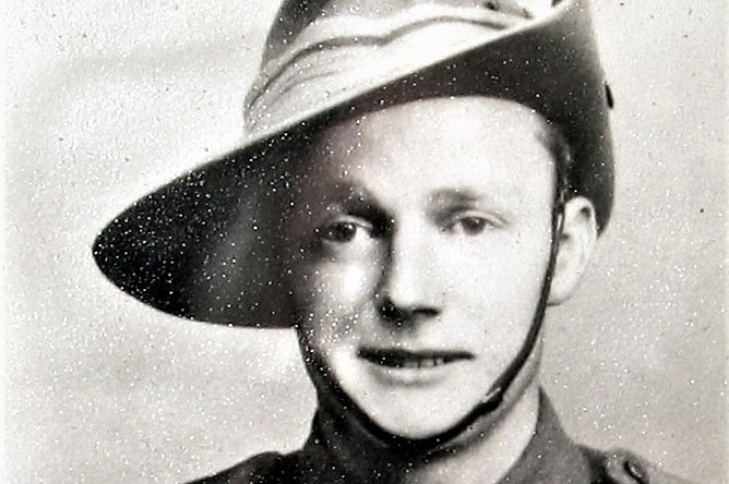 World War II-era headshot of army man wearing uniform and Australian slouch hat.