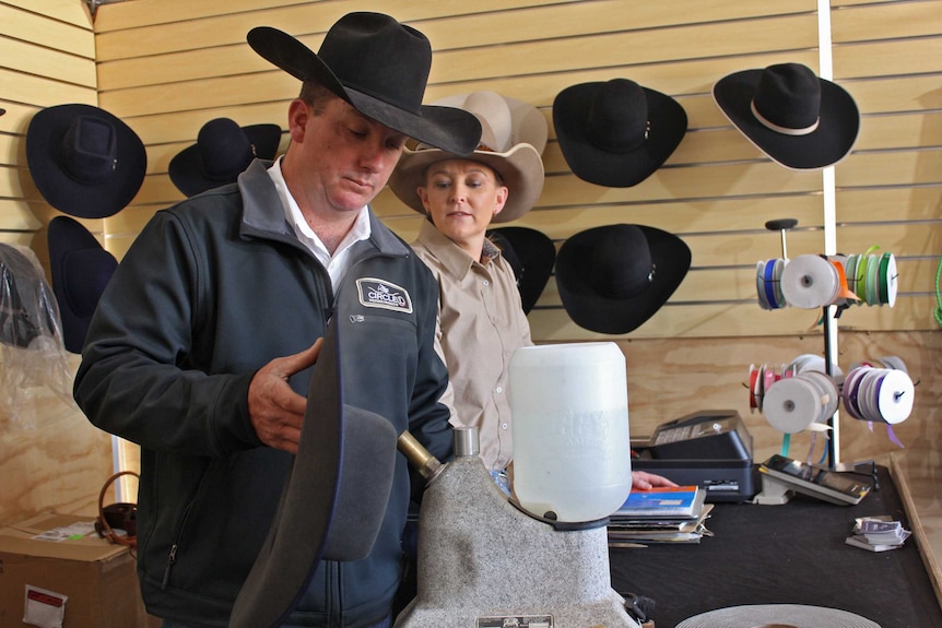 Clayton Lavendar shapes a hat