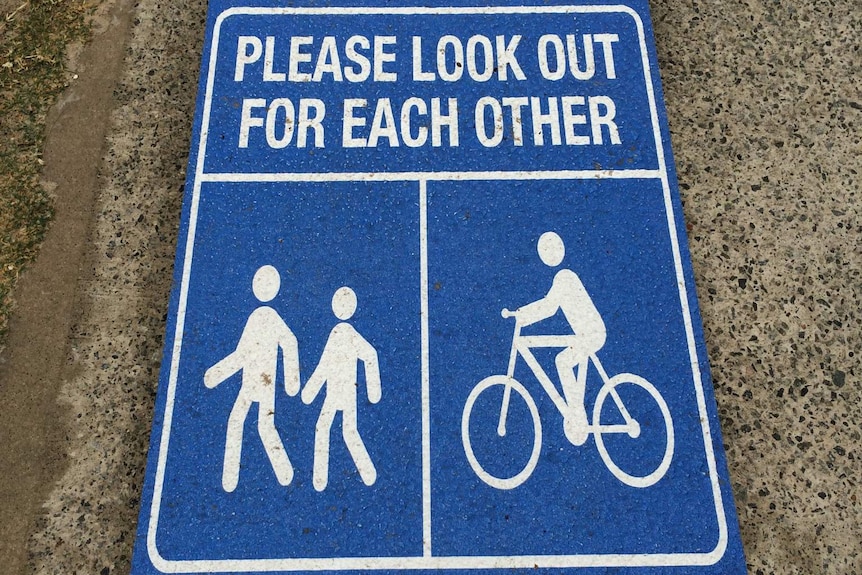 Sign to cyclists and pedestrians on a shared path in Cottesloe