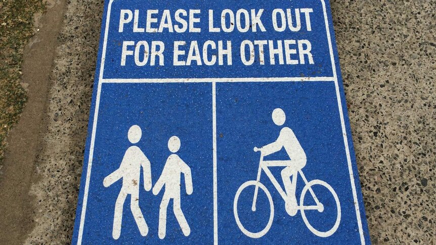 Sign to cyclists and pedestrians on a shared path in Cottesloe