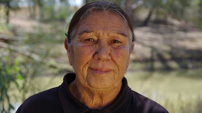 A woman wearing a black shirt.