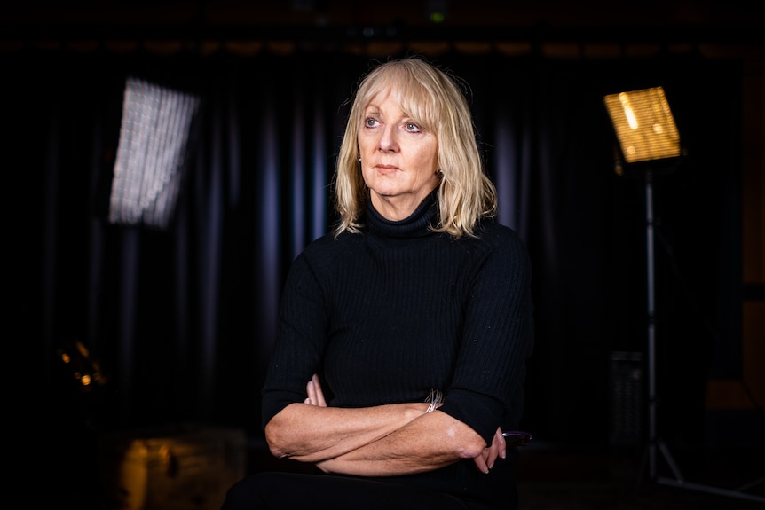 Executive Producer of Four Corners Sally Neighbour in a dark studio.