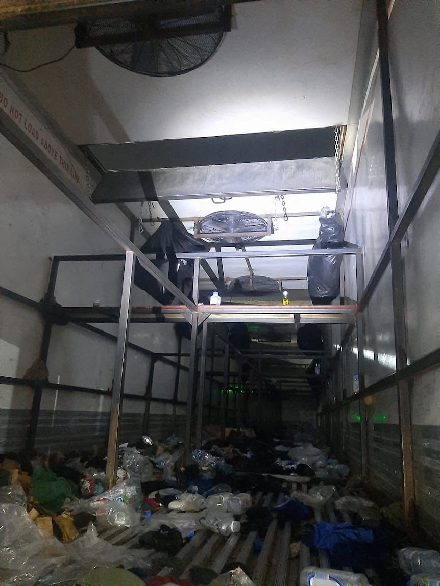 A view of an abandoned truck trailer where Mexican authorities found 343 migrants from Central America.