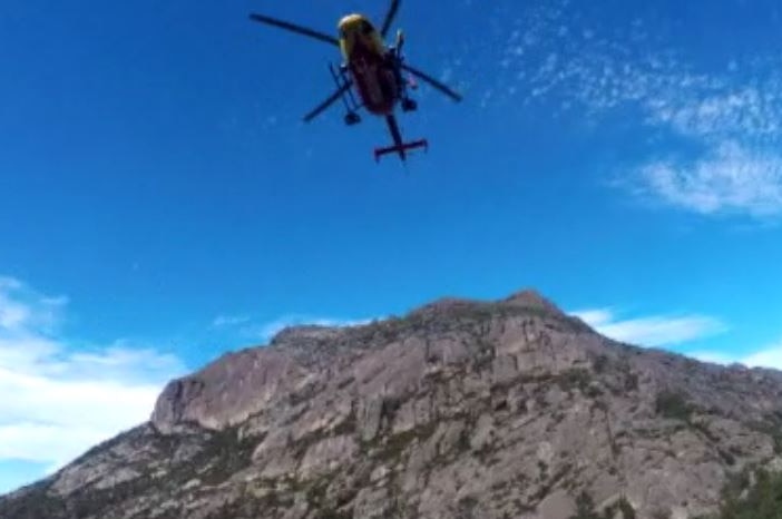 Helicopter overhead during bushwalker rescue at Freycinet National Park.