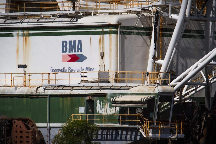 The rear of a drag-liner that shows the BMA Goonyella Riverside Mine logo.