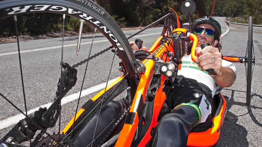 Greg Allen readies to put his hand-cycle to work on Gorge Road, near the Kangaroo Creek Reservoir in the Adelaide Hills.