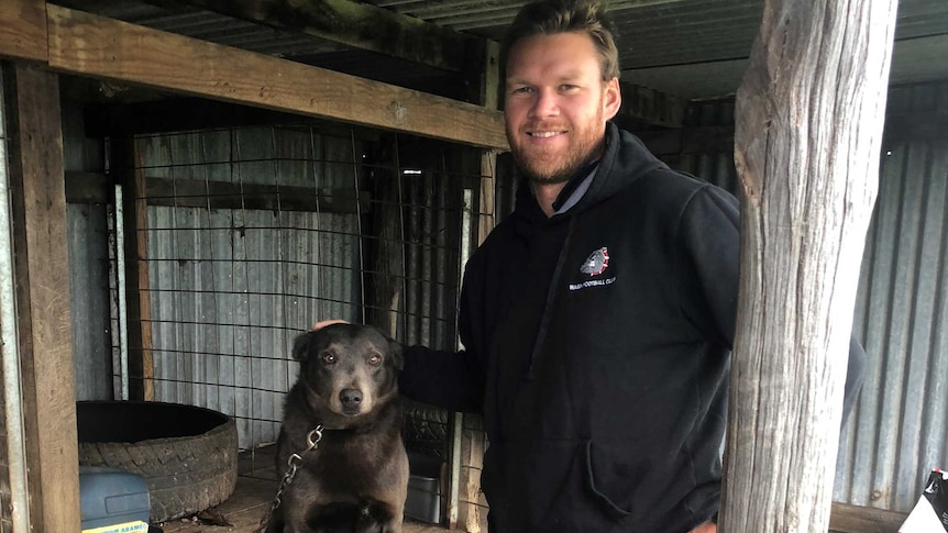 Former AFL player Paul Duffield with his dog Blue