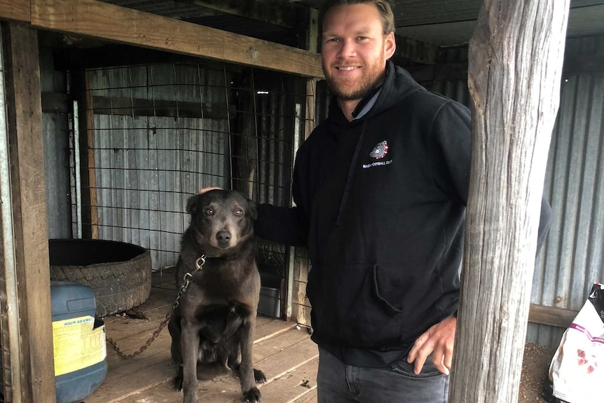 Former AFL player Paul Duffield with his dog Blue