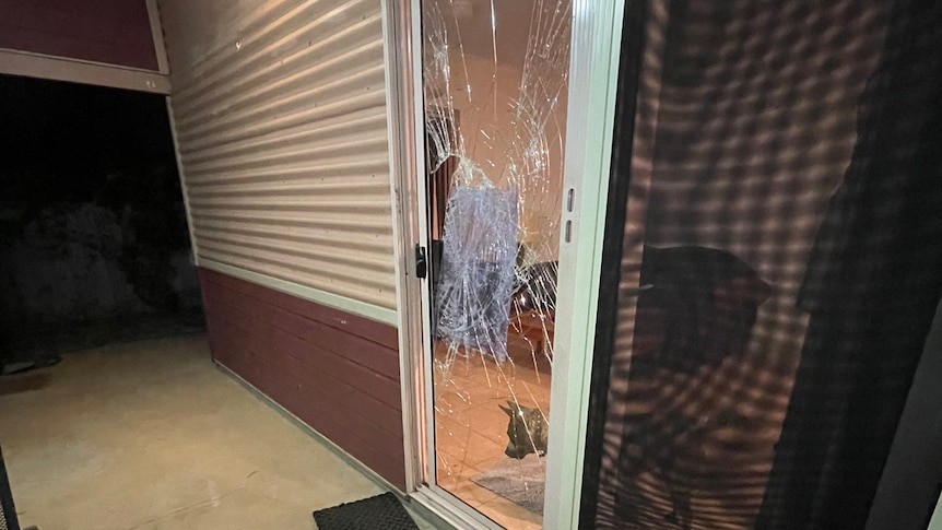 A shattered glass sliding door