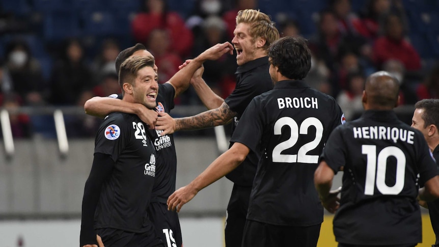 Brandon Borrello #28 of Brisbane Roar celebrates the first goal with team-mates