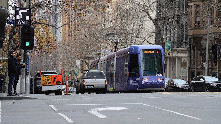 A tram standing at a Melbourne intersection