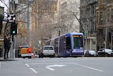 A tram standing at a Melbourne intersection