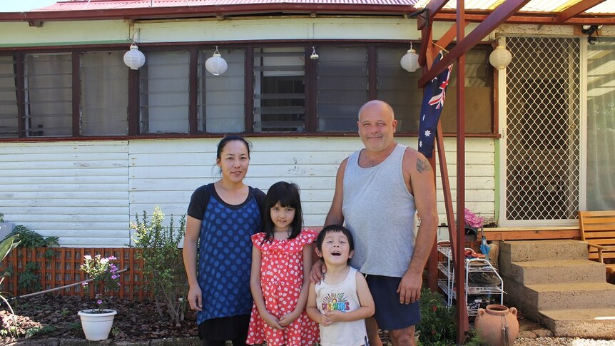 Shane Steddman standing in front of his house with his wife Naomi and children Sarah and Ricky.