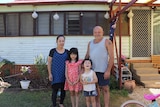 Shane Steddman standing in front of his house with his wife Naomi and children Sarah and Ricky.